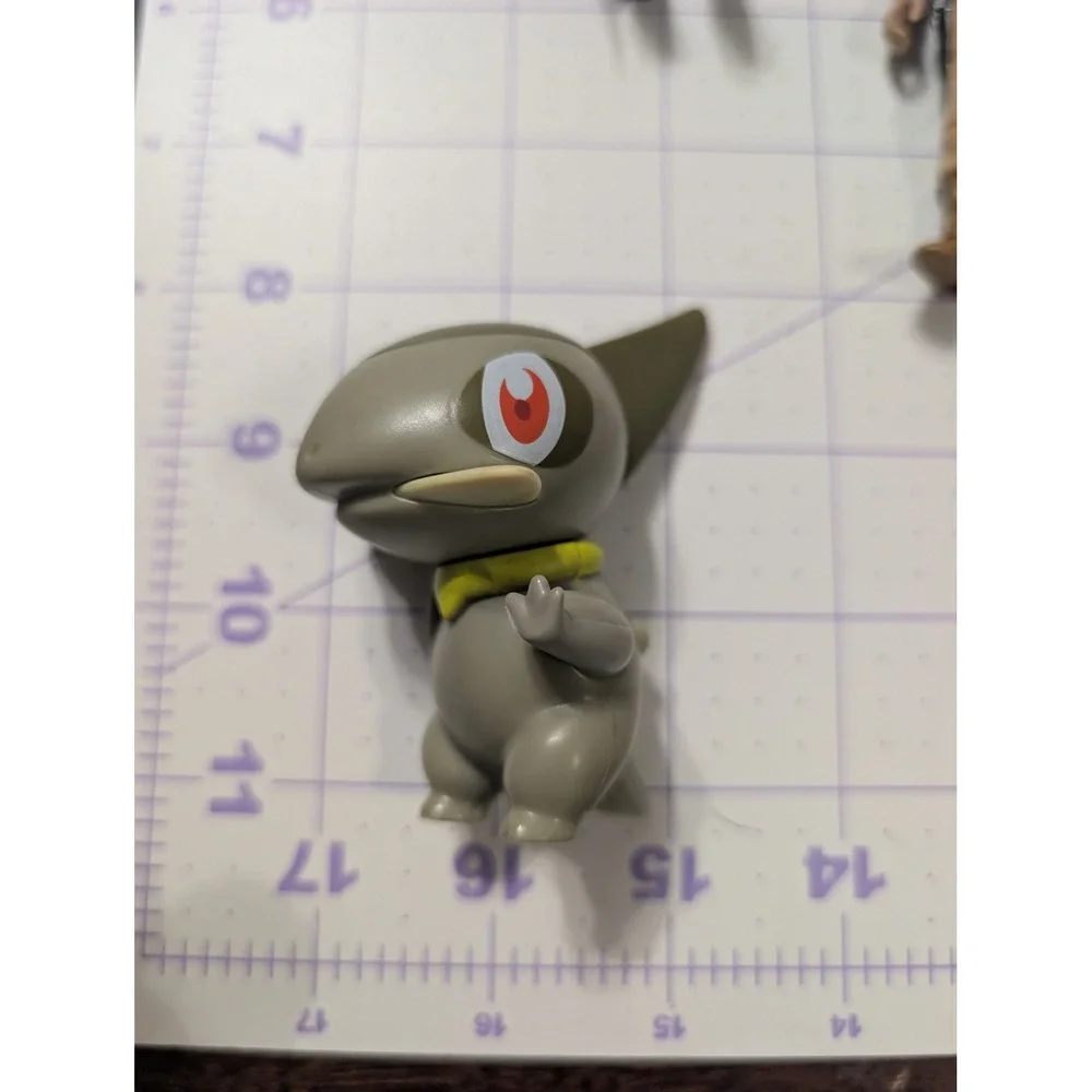 Pokemon Axew Mini Figure Dragon Type Collectible Toy Olive Green 2 Inch